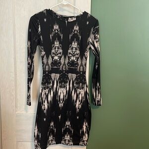 Black midi dress with opening slits in the back